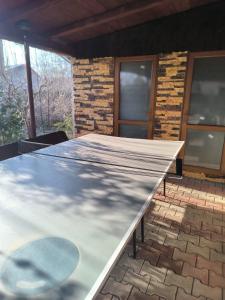 a large metal table in front of a house at Casa Berbec in Dealul Viei