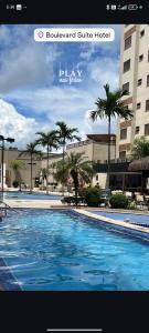 a picture of a swimming pool in a hotel at Boulevard suite hotel apartamento 434 in Caldas Novas