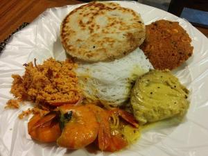 a white plate of food with eggs rice and bread at Forest Garden Cottages in Deraniyagala