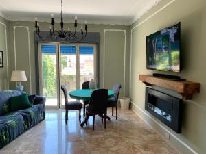 a living room with a table and a tv at B&B Fiorisol in Augusta