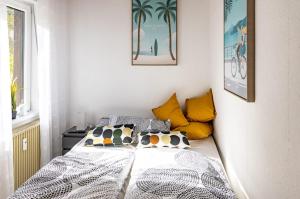a bedroom with a bed with pillows on it at Moselgoldt in Burg