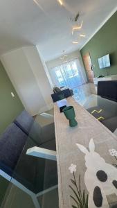 a living room with a couch and a dining room at Green House Boca Chica in El Higo +19 photos