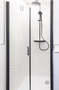 a shower with a glass door in a bathroom at Moselgoldt in Burg +29 photos