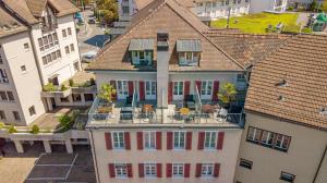 an aerial view of a building with a balcony at Gasthof zum Falken in Frauenfeld