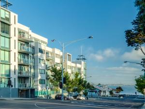 an apartment building on the side of a street at Waterfront (Yarra St) by Gold Star Stays in Geelong