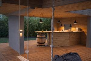 a room with a kitchen and a bar in a house at Cap Ferret Villa Océane in Lège-Cap-Ferret