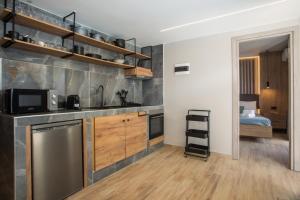 a small kitchen with a sink and a microwave at Casa Gemma 3 in Rhodes Town +8 photos