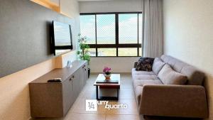 a living room with a couch and a table at Heron Marinho Flats in Campina Grande +93 photos