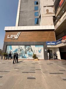 a group of people standing in front of a building at Luxury Jacuzzi Studio -Couple Friendly- Noida in Ghaziabad +28 photos