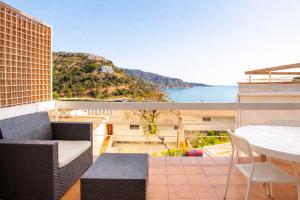 a balcony with a view of the ocean at Cala Paradiso in Tossa de Mar