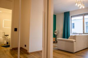 a living room with a couch and a window at Lakeside Lugano in Lugano +133 photos
