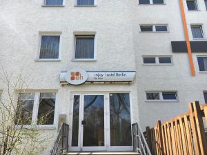 a building with a sign that reads entry used bath at enjoy hostel Berlin City West in Berlin