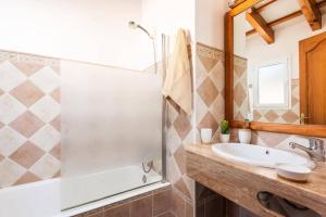 a bathroom with a shower and a sink at Villa Maru I by Villa Plus in Cala en Porter +13 photos