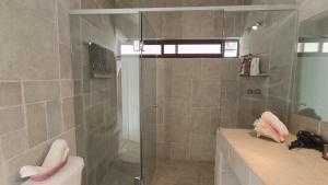 a bathroom with a shower and a sink at Popo Country House in Atlautla +23 photos