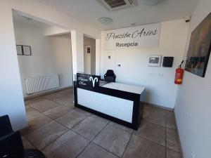 a room with a counter with a sign on the wall at Apartmány ARIES in Nitra