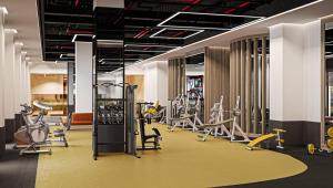 a gym with several treadmills and exercise bikes at Sinnada Resort & Thermaland in Afyon
