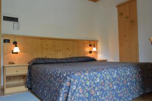 Postel nebo postele na pokoji v ubytování Hotel Giardino