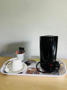 affeepot on a tray on a table at Lugogo Guesthouse in Thohoyandou