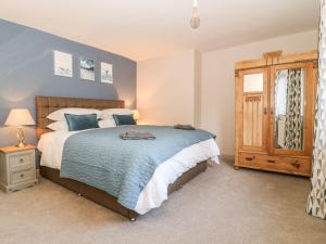 a bedroom with a large bed and a window at Old Post Office in York