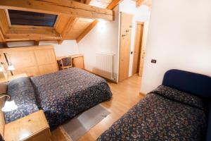Postel nebo postele na pokoji v ubytování Hotel Giardino