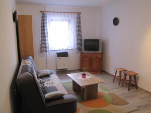 A television and/or entertainment centre at Privát Magdalena
