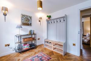 a room with a white door and a wooden floor at Cosy Lake District Cottage - Walk to Windermere - Sleeps 6 in Windermere +19 photos