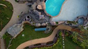 an overhead view of a garden with a house at Crystal Falls Wayanad in Wayanad +5 photos