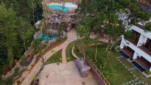 an aerial view of a park with a pool at Crystal Falls Wayanad in Wayanad