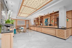 a lobby with a hair salon at Crowne Plaza Budva by IHG in Budva +142 photos