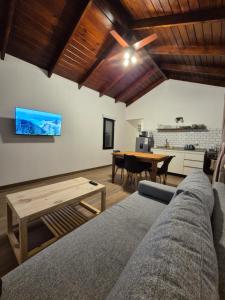 a living room with a couch and a table at Quintasdeconde in San Miguel del Monte