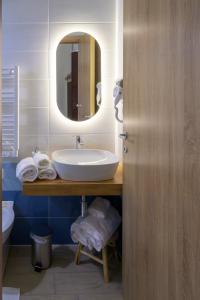 a bathroom with a sink and a mirror at Domus Gargilius in Pompei +29 photos