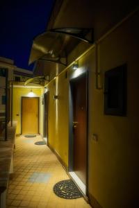 an empty hallway of a building at night at Domus Gargilius in Pompei