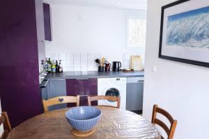 a kitchen with a table with a bowl on it at Mountain getaway in Saint-Chaffrey in Saint-Chaffrey