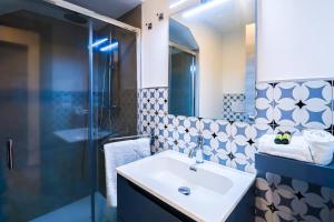 a bathroom with a sink and a mirror at Umberto I by Casa di Marco in Sannicola +59 photos