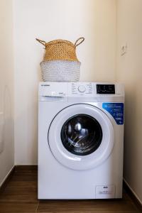 a washing machine with a basket on top of it at Umberto I by Casa di Marco in Sannicola