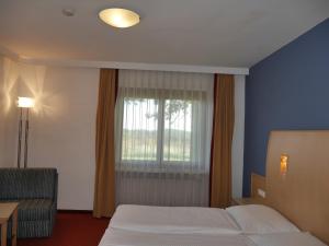Krevet ili kreveti u jedinici u okviru objekta Hotel Garni Höchschmied