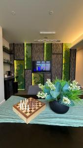 a chess board on a table in a living room at The Party Hub in Boston