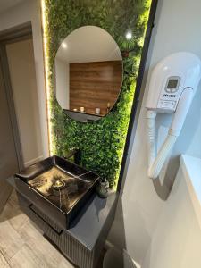 a bathroom with a sink and a mirror at The Party Hub in Boston +9 photos