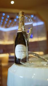 a bottle of champagne with a wine glass at The Party Hub in Boston
