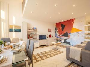 a living room with a table and a dining room at Lemon Tree House in Bari +11 photos