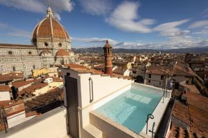 a view from the roof of a building with a swimming pool at Donati Luxury Tower Suites in Florence