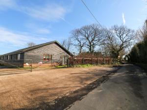 a house sitting on the side of a road at Bluebell Cottage in Maidstone