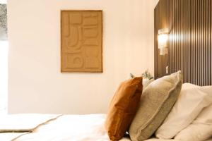 a bedroom with a bed with two pillows on it at Lovely Studio Flat on Bath Road - Flat 8 in Bristol +23 photos
