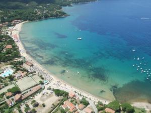 an aerial view of a beach with boats in the water at Casa Novella - Argonauti Vacanze in Procchio