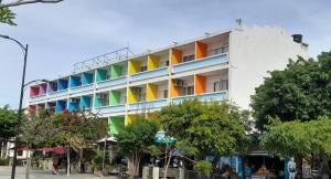 a building with colorful balconies on the side of it at Panamerican Hostel in Santa Marta