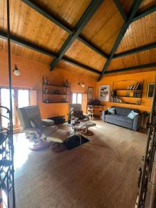 a large living room with a couch and a table at Casa del arco in Tarilonte