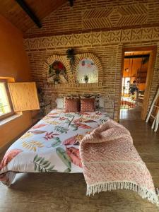 a bedroom with a large bed in a room at Casa del arco in Tarilonte