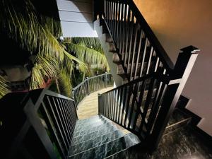 a stairway leading up to a house with a staircase at Lethi Family Villa in Negombo