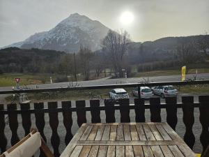 a view of a mountain with cars parked on a road at Chambre La Charolaise in Aubessagne