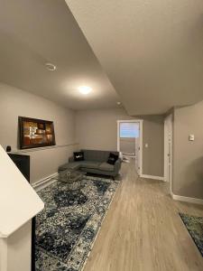 a living room with a couch and a table at Federal Palace in Saskatoon